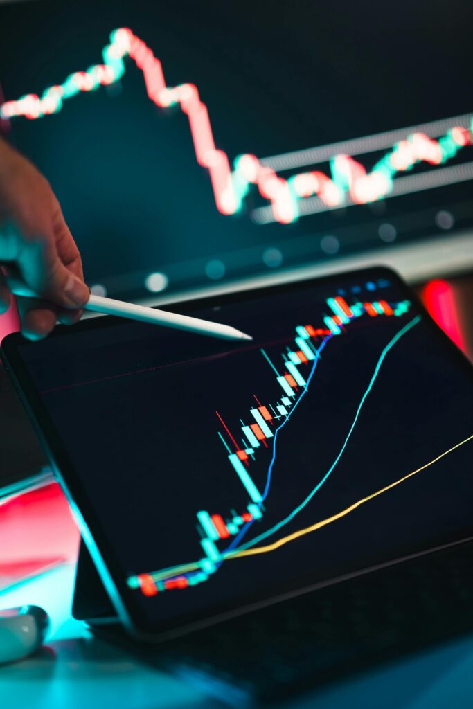 Binary Option Training Close-up of cryptocurrency trading analysis on a digital tablet, highlighting market trends.